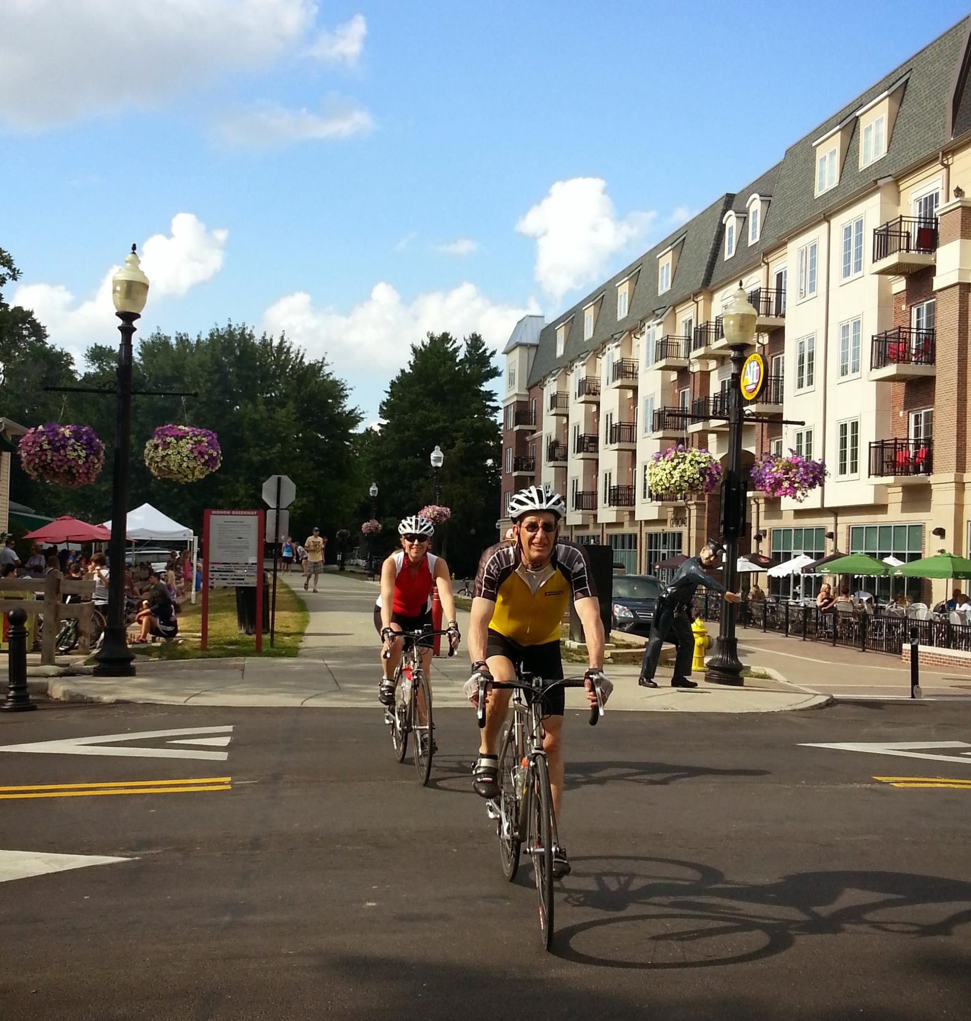 Cyclists with helmets at Monon and Main